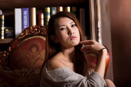 Sexy Asian woman on armchair.の写真素材