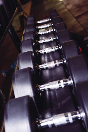 weights and equipment at a gymの写真素材