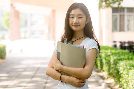 Portrait of a Asian college student at campusの写真素材