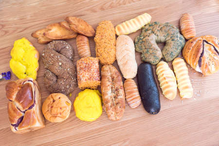 Bakery products on a wooden desk backgroundの写真素材