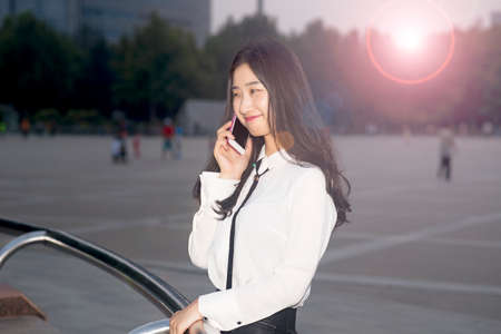 Young girl call the night in the streetsの写真素材