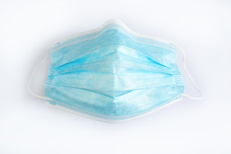 Close-up surgical mask isolated on white background.