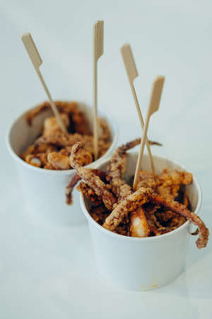 Fried giant squid tentacles seasoned with spice powderの写真素材