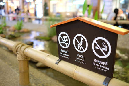 Prohibit sign post on the bamboo fenceの写真素材