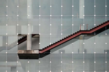 An under construction ladder outside building, also demonstrating an upward trend line graphの写真素材
