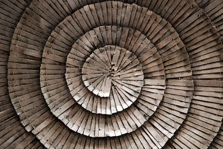 Silver iron plates in a coiled patternの写真素材