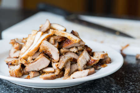 Chopped juicy grilled pork in kitchen sceneの写真素材