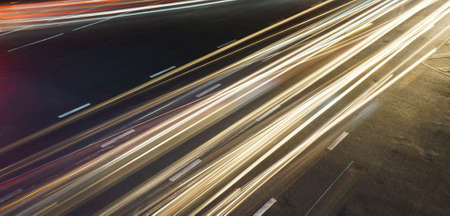 Long exposure light trails across road junctionの写真素材