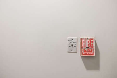 Fire alarm system and telephone connector port with separate clipping paths, copy space on concrete wall backgroundの写真素材