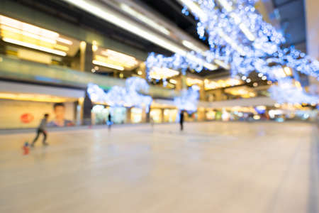 Blur background image of ice skating rink with bokeh of decoration light bulbsの写真素材