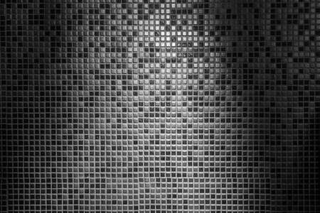 Light and shade abstract background of gray tiled wall in grid patternの写真素材