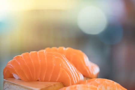 Salmon sushi, Japanese food delicious menu, bokeh blurred background with copy spaceの写真素材