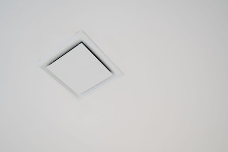 Modern air conditioner or air vent on ceiling with clipping path and copy spaceの写真素材