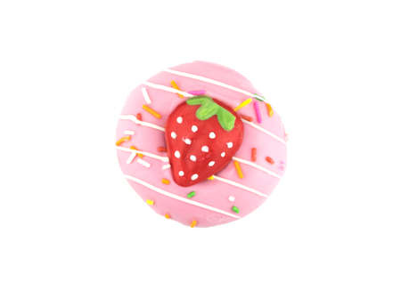Fancy sweet strawberry doughnut or donut with sprinkles, isolated on white backgroundの写真素材