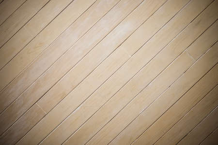 Laminate wood wall texture background, center spotlight, darken edge, diagonal patternの写真素材