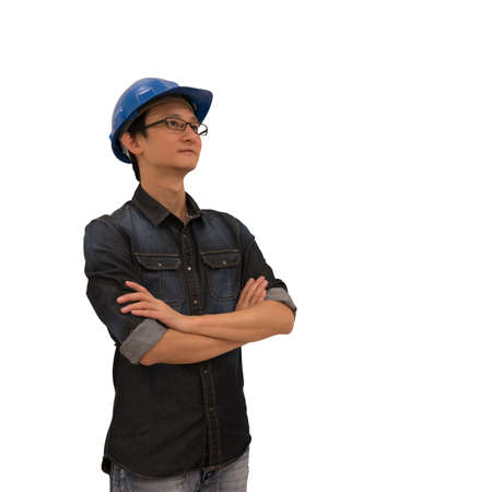 Asian architect or engineer looking upward, with clipping path, isolated on white background, industry or architect or engineering concept, young and handsome character look at copy spaceの写真素材