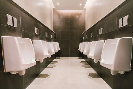 Urinals in men's public modern toilet, restroom sanitary or wc architecture design conceptの写真素材