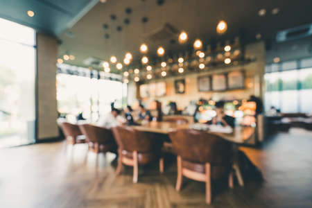 Blur background of modern coffee shop or indoor cafe. Casual lifestyle concept or graphic resourceの写真素材