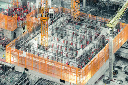 Isometric top view of an under construction building. Civil engineering, industrial development project, tower basement foundation infrastructure, or real estate property investment conceptの写真素材