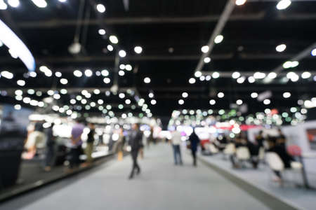 Blur, defocused background of public exhibition hall. Business tradeshow, job fair, or stock market. Organization or company event, commercial trading, or shopping mall marketing advertisement conceptの写真素材