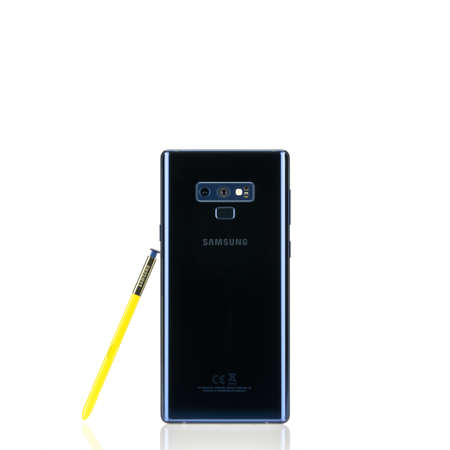 Bangkok, Thailand - Sep 10, 2018: Studio shot of new Samsung Galaxy Note 9 smartphone in ocean blue color with yellow S-Pen stylus, rear camera view, isolated white background. Illustrative editorial.のeditorial素材