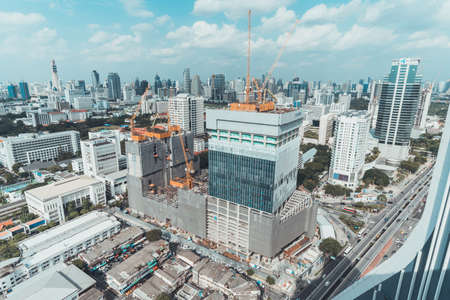Bangkok, Thailand - Sep 6, 2018: Construction site of office building, shopping center, or community mall project in Bangkok, Thailand. Aerial top view cityscape on sunny day.のeditorial素材