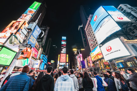 New York City, United States - Mar 31, 2019: Crowded people, car traffic transportation and...