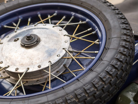 Tire motorcycle wheel with metal spokes vintage car close-upの写真素材