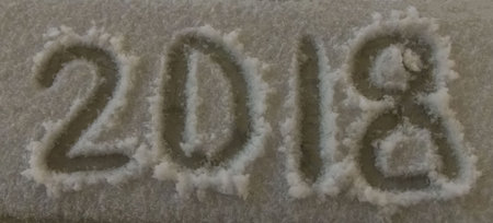 two thousand eighteenth year, 2018, inscription on white snow background close-up, christmas...