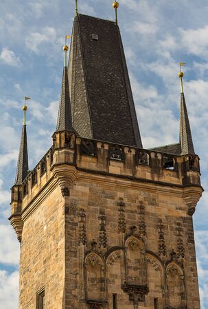 bridge tower  Charles Bridge. Little tower of Malostranskaya on a background of blue sky close-up. Czech Republic Prague February 2017のeditorial素材