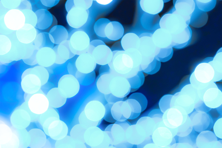 abstract background blue blurred round spots bulb colorful festive foundation contrast design on a dark backgroundの写真素材