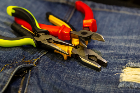 set pliers pliers repairing electricity repair close-up on a background of denim hand toolsの写真素材