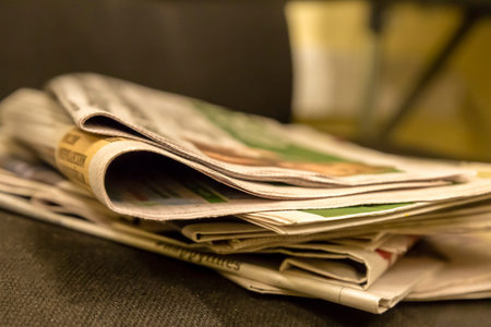 morning press traditional breakfast businessman hot coffee stack of newspapers quotations fresh sports newsの写真素材