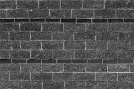 stone gray horizontal part of the building building rough bricks weather-beaten dark substrate urban grunge styleの写真素材