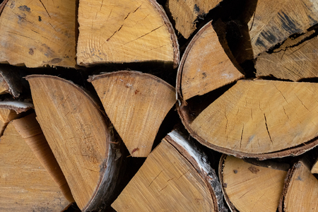 birch logs firewood stack material background eco basis natural weathered cracked clothの写真素材