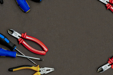 group home repair master screwdriver black yellow pliers set of screwdrivers copy dpace on dark background mockupの写真素材