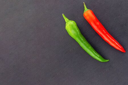 mature pod of sharp peppers parallel vegetable bright design design right angle frame on black backgroundの写真素材