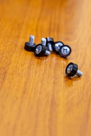 engineering background design repair computer set bolts on a wooden baseの写真素材