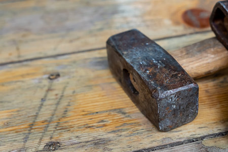 construction design, working construction tool sledgehammer with heavy metal head close-up on the...