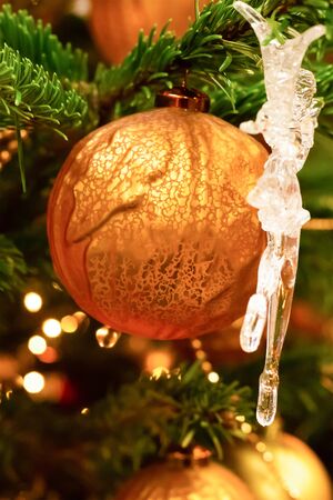 orange bright big ball new year icicle close up festive christmas backgroundの写真素材