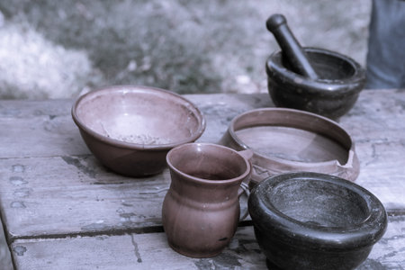 traditional rustic crockery ceramic plates and a clay jug standing on a table