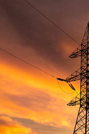 base high-voltage power in the sunset sky lines postcard engineering copy spaceの写真素材