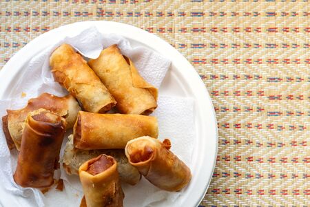 spring roll fried on a plate white delicious lunch on the streets of Vietnamの写真素材