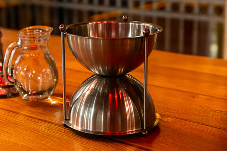 wine cellar set for tasting decanter with water, metal spittoon used to select wines