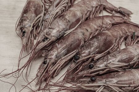 shrimp set toned whole seafood fresh on wooden backgroundの写真素材