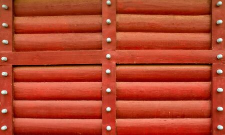 red log wall wooden horizontal logs part of the wall of the protective fortの写真素材