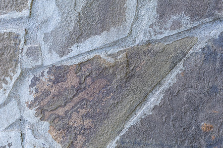background of weathered stone and uneven cement and gray lines
