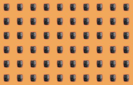 old gray barrel pattern on a bright orange backgroundの写真素材