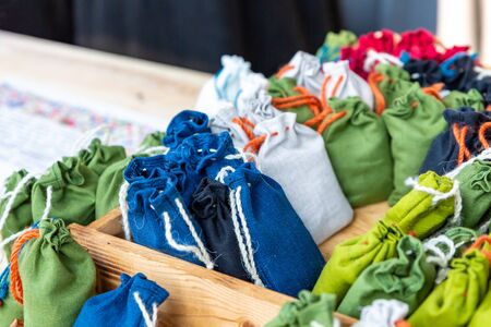 assorted cotton bags filled with medicinal herbs, fragrant sachetsの写真素材