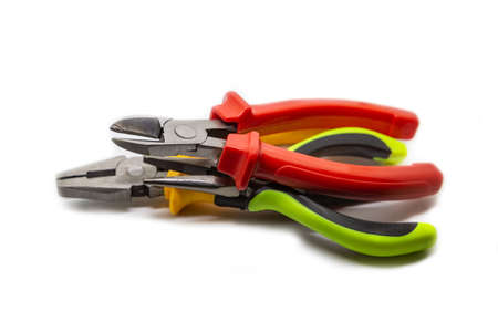 Stack of working electrician hand tools piled in a stack on an isolated backgroundの写真素材